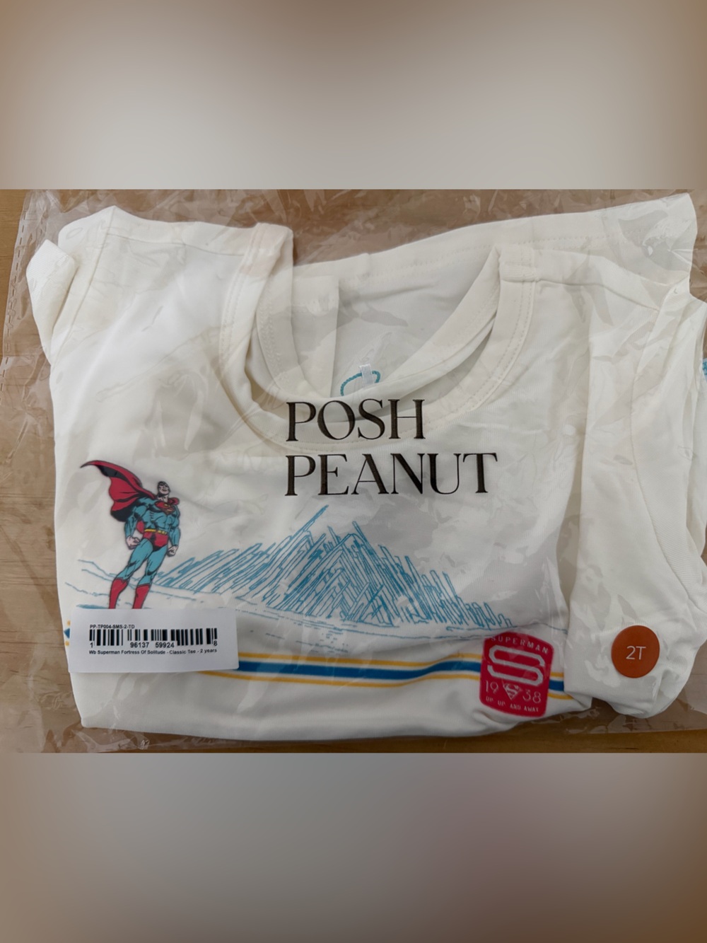 Posh Peanut Cream Short Sleeve Tee with Superhero Graphic and Blue Accents